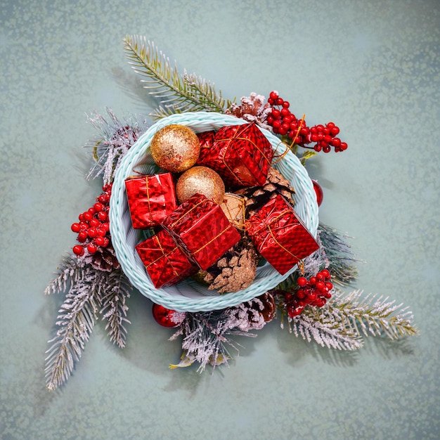 Basket with Christmas toys on textured background, plan view.