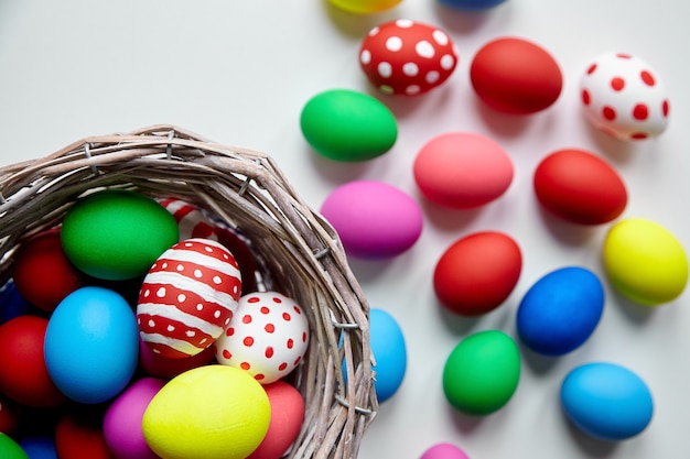 Basket with colorful decorated Easter Eggs