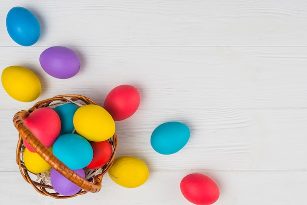 Photo basket with easter eggs on light table