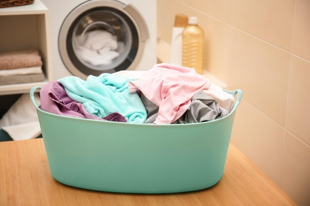 basket with laundry on table in bathroom