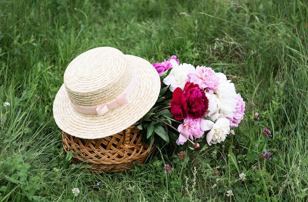 Basket with peony flowers