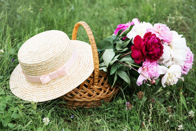 Basket with peony flowers