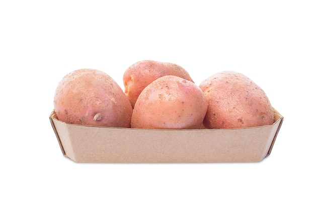 Basket with pink potatoes isolate