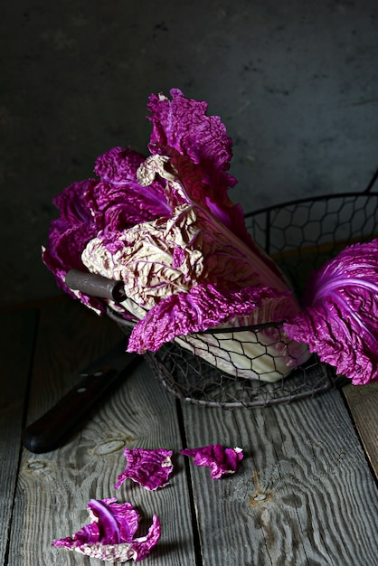 Basket with Purple Peking cabbage on black