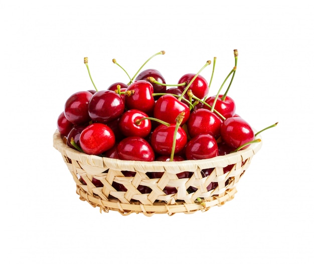 Basket with ripe wet cherry isolated