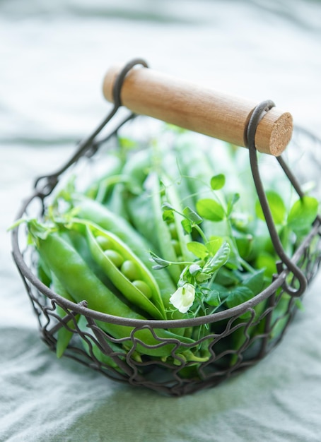 Basket with sweet pea pods