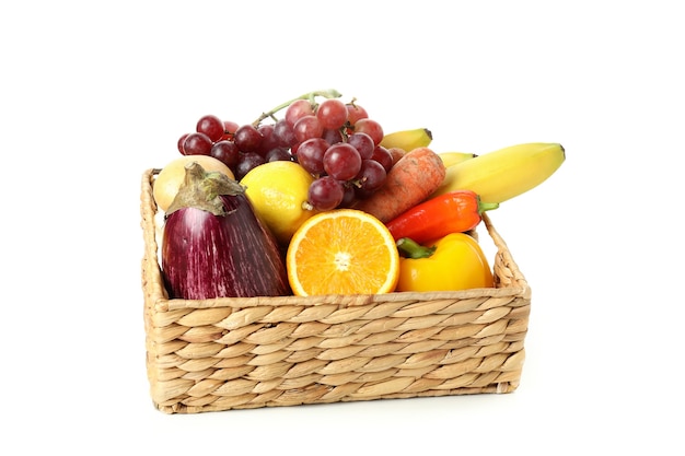 Basket with vegetables and fruits isolated on white background