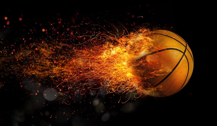 Foto basketbal in vlam gaat snel naar de basket