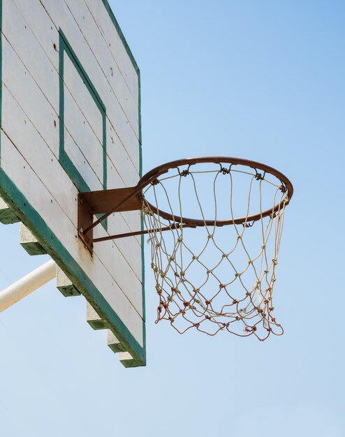 Basketball hoop on blue sky