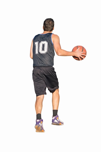 Basketball player dribbling on white background