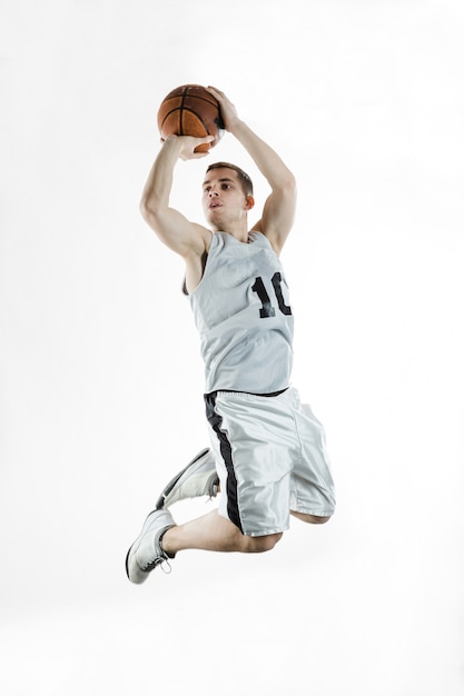 Basketball player jumping acrobatically