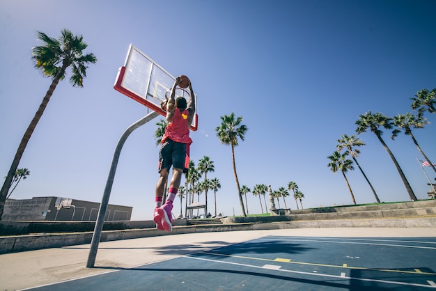 Basketball player making a dunk