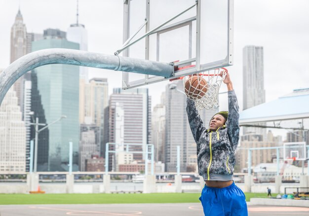 Basketball player making a slam dunk