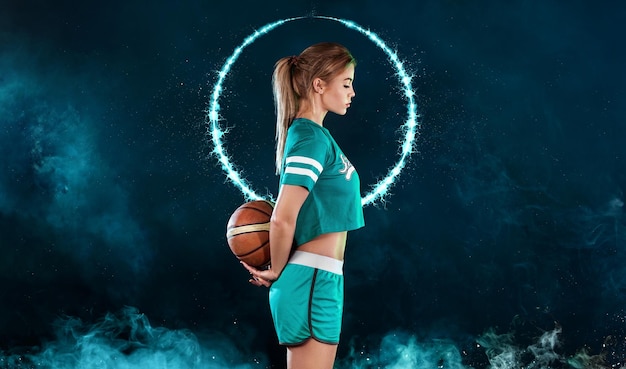 Basketball player Portrait of woman with a basketball ball in studio Sports betting concept Game day