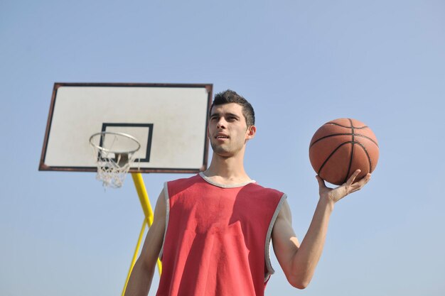 basketball player practicing and posing for basketball and sports athlete concept