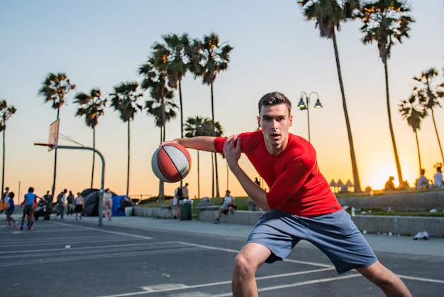 Basketball player sports and basketball man jumps and throws a
ball into the basket