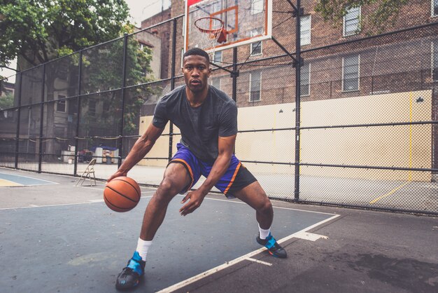 Basketball player training on a court in New york city