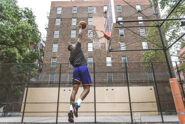 Basketball player training outdoors