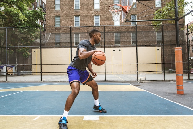 Basketball player training outdoors