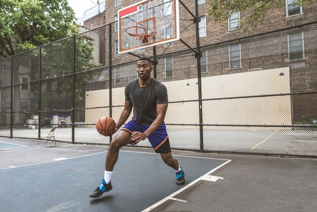 Basketball player training outdoors