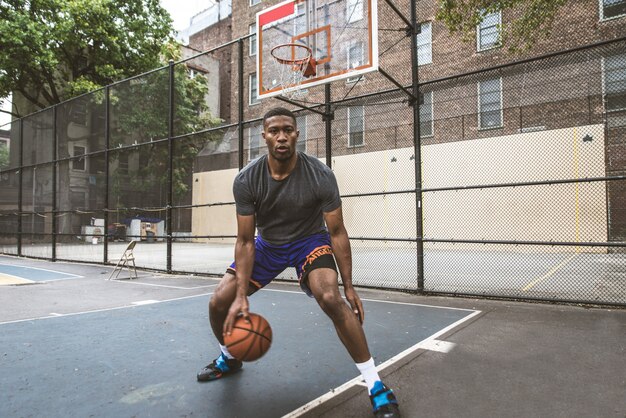 Basketball player training outdoors