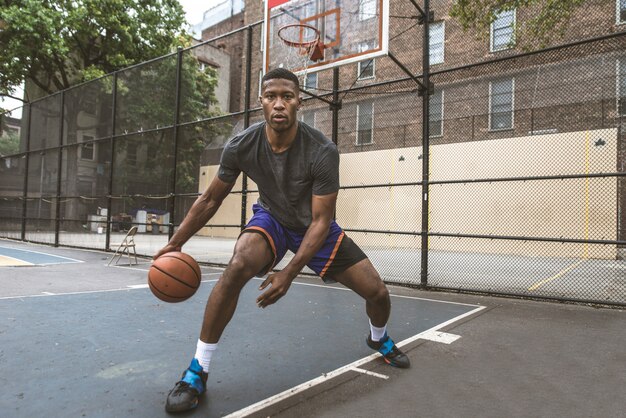 Basketball player training outdoors