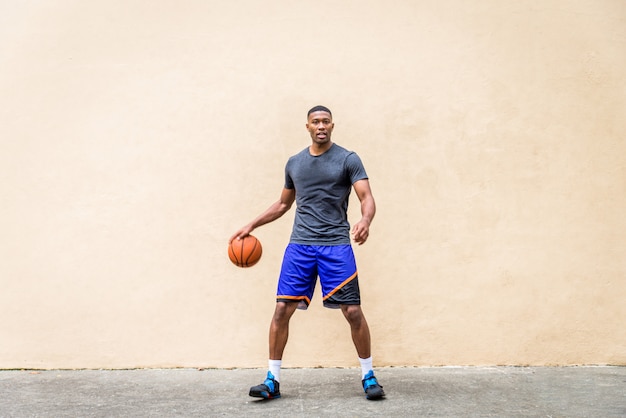 Basketball player training outdoors