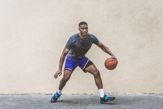 Basketball player training outdoors