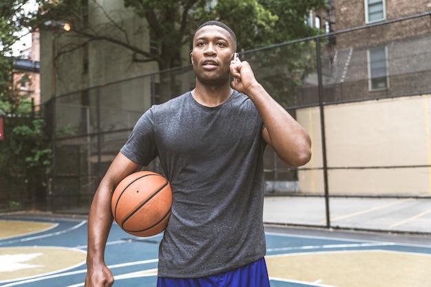 Basketball player training outdoors