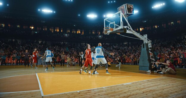 Basketball players on big professional arena during the game Tense moment of the game Celebration