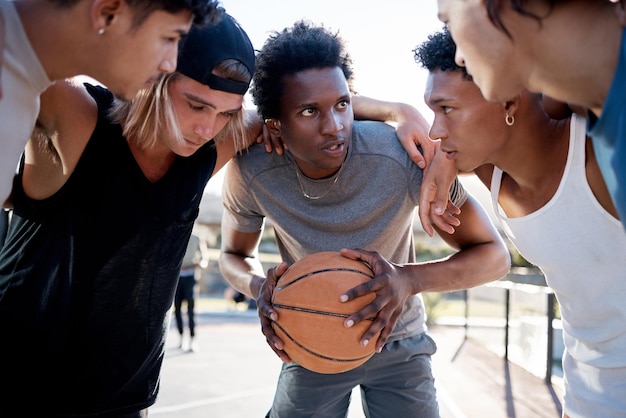 Photo basketball team and huddle on basketball court in trust circle for motivation planning and game strategy fitness friends and basketball players share sport goal mission and support while talking