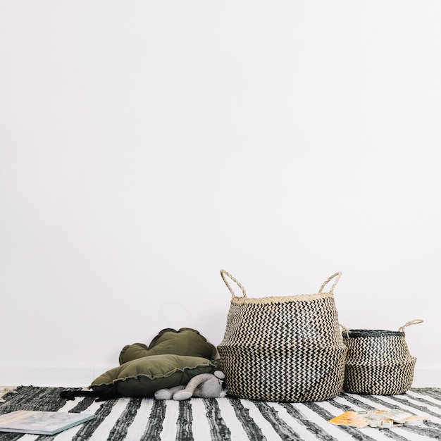 Photo baskets on striped rag in nursery
