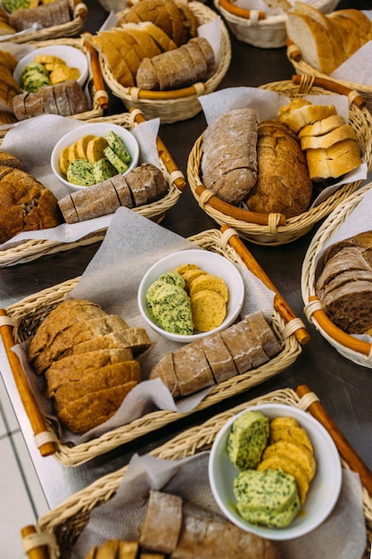 Baskets with baked goods and butter on holiday. Catering.