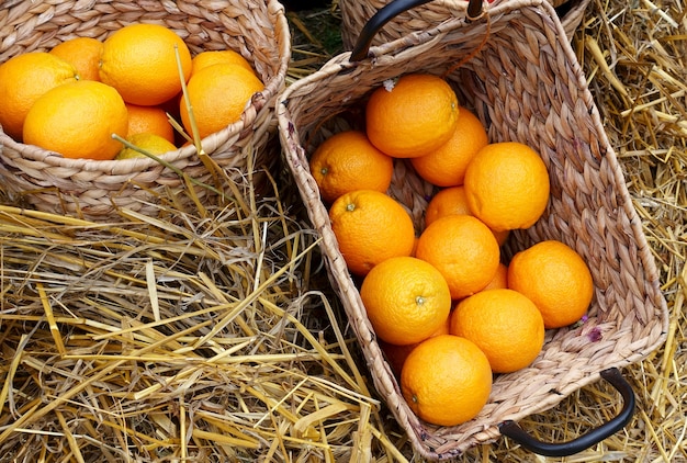 Baskets with oranges fruits