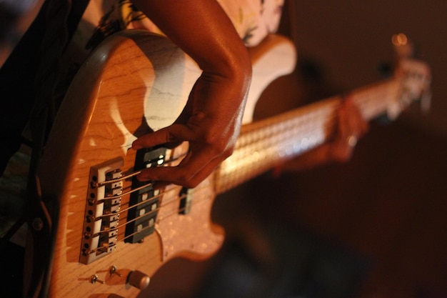 Photo bassist playing on stage