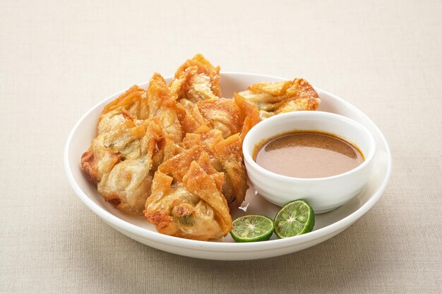 Batagor made from fish or chicken dumpling tofu tapioca flour served with peanut sauce Indonesia