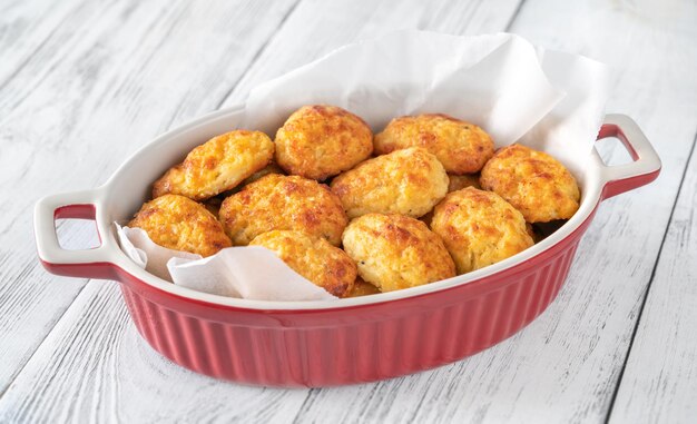 Batch of baked cheesy cauliflower tots close up