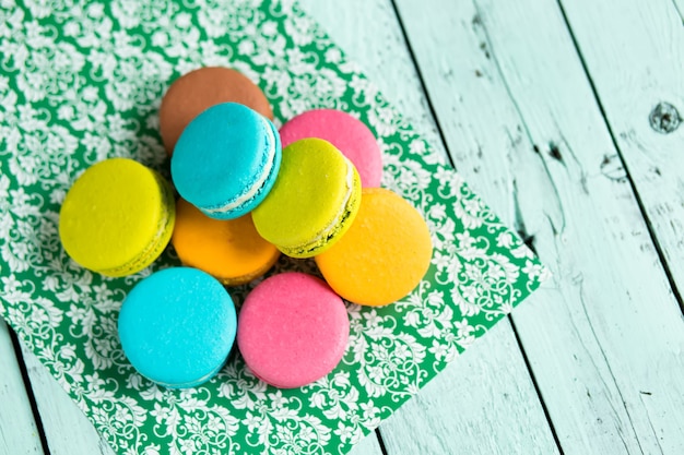 A batch of coloroful french macaroons on a table
