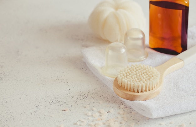 Bath accessories on white stone surface