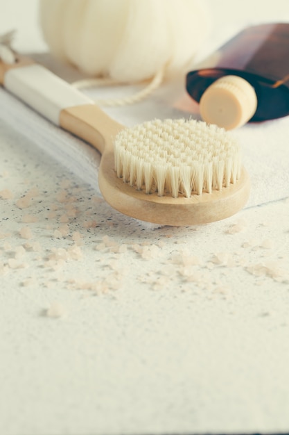 Bath accessories on white stone surface