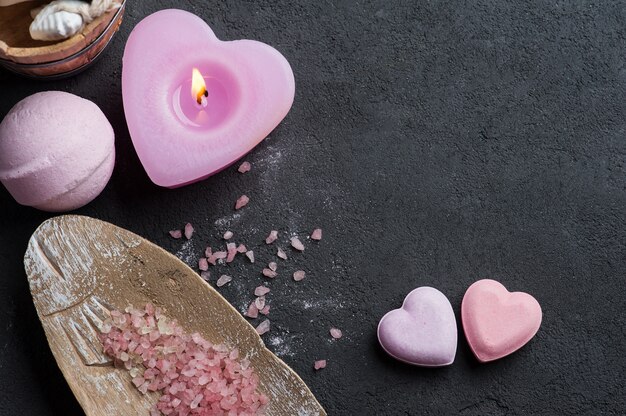 Photo bath bomb closeup with pink lit candle