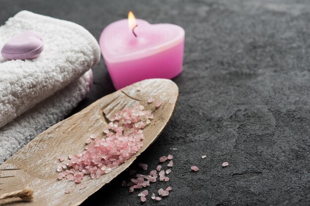 Bath bomb closeup with pink lit candle