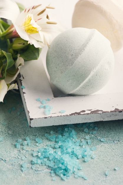 Bath bombs on blue concrete background