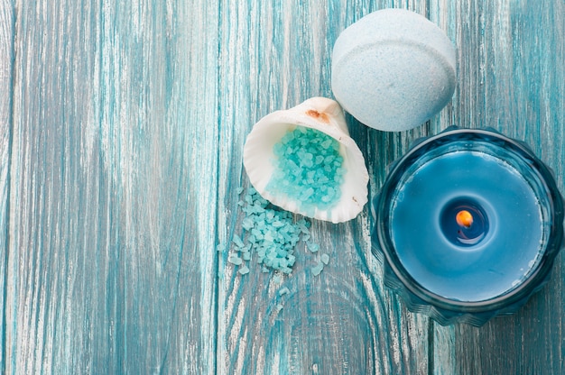 Bath bombs closeup with blue lit candle