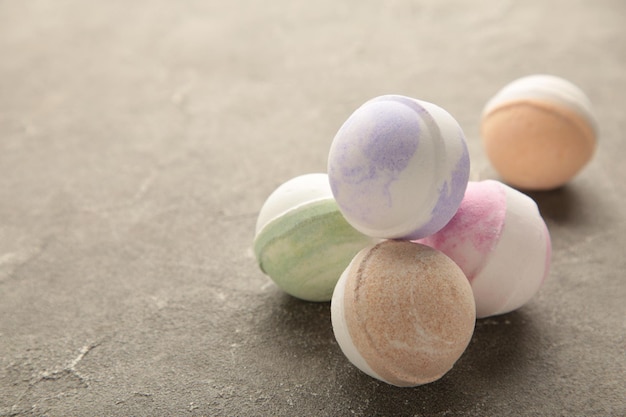 Bath bombs on grey concrete background. Bathroom composition