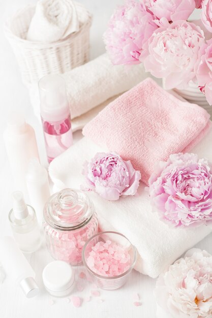 Bath and spa with peony flowers beauty products towels