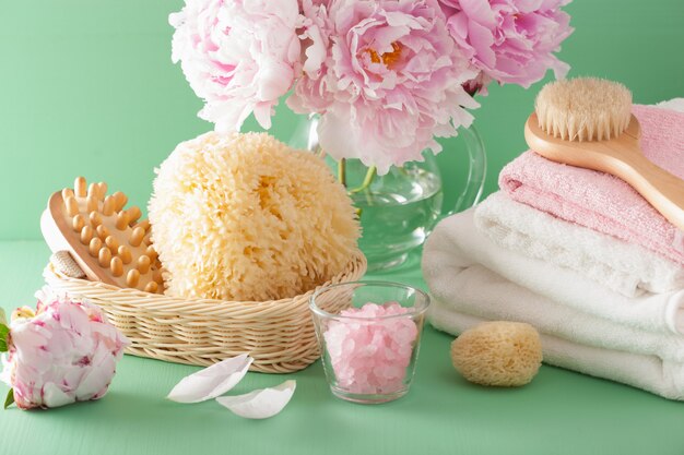 Bath and spa with peony flowers brush sponge towels