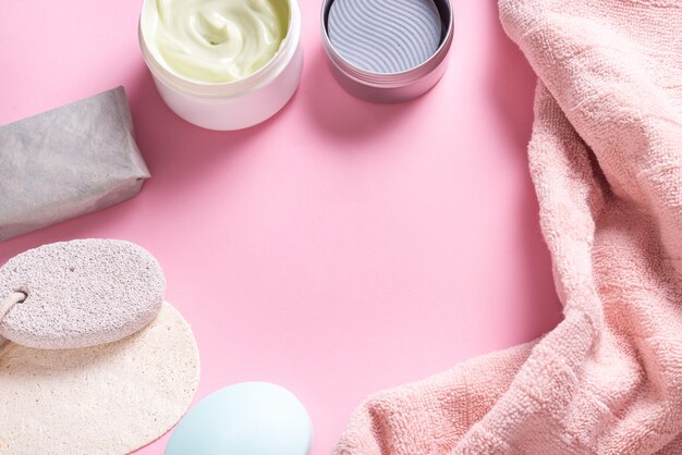 Bath tools, towel, cream and soap on toilet table