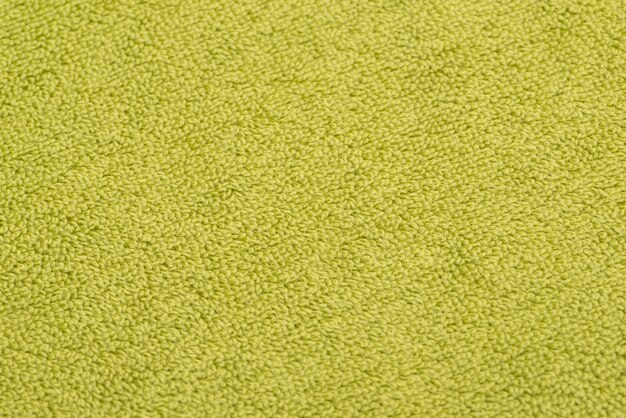 Bath towel bright green. textured fabric background