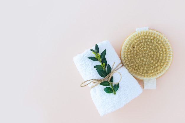 Bath towel with green leaf and body brush